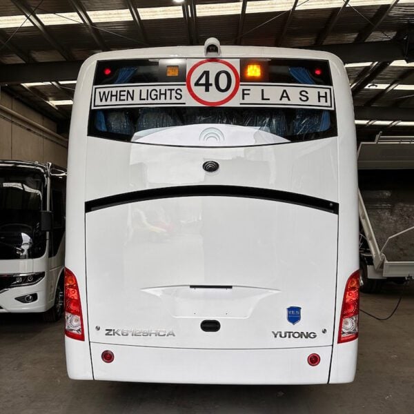 Photo of the rear of a Yutong D9 bus with Safebus SB001B window mount school bus lights and NSW TS150 signage installed
